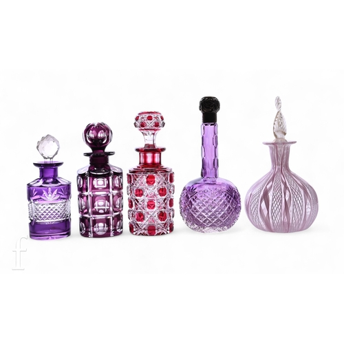 706 - A Victorian amethyst glass scent flask, of onion form, the high drawn facet cut stem fitted embossed... 