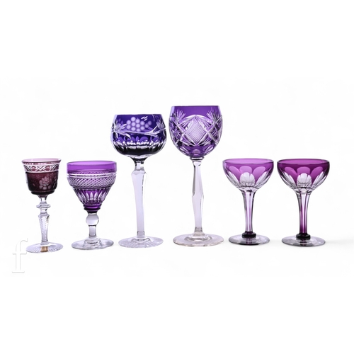 707 - A collection of amethyst glass stem ware, to include a Meissner amethyst glass liqueur glass, intagl... 