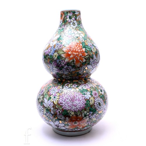 490 - A contemporary double gourd famille rose vase, gilt heightened polychrome millefiori decoration in t... 