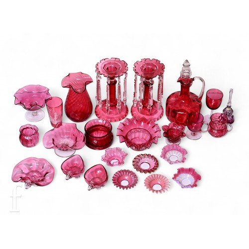 709 - A pair of Victorian ruby glass table lustres, each fitted with clear glass drops on facet cut stems ... 