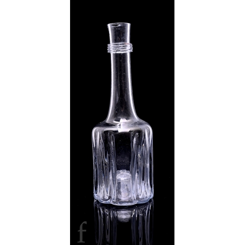 721 - An 18th Century cruciform decanter circa 1730, dark metal, moulded base rising to a rounded shoulder... 