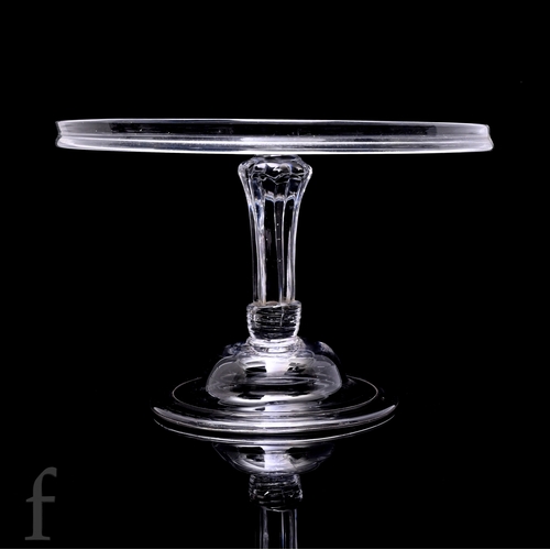 723 - An 18th Century clear crystal glass tazza circa 1760, with a wide circular top with collar rim, abov... 