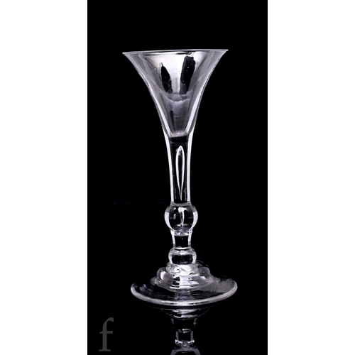 724 - An 18th Century Kit Kat type drinking glass circa 1720, drawn trumpet bowl above a stem with interna... 