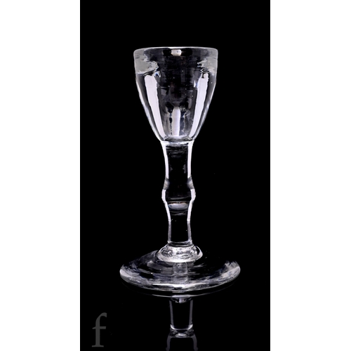 729 - An 18th Century toastmaster drinking glass circa 1740, the deceptive bowl above a balustroid stem wi... 