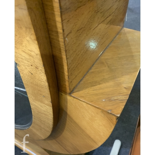 738 - Unattributed Maker - An Art Deco walnut veneered display cabinet of stylised spearhead form, with le... 