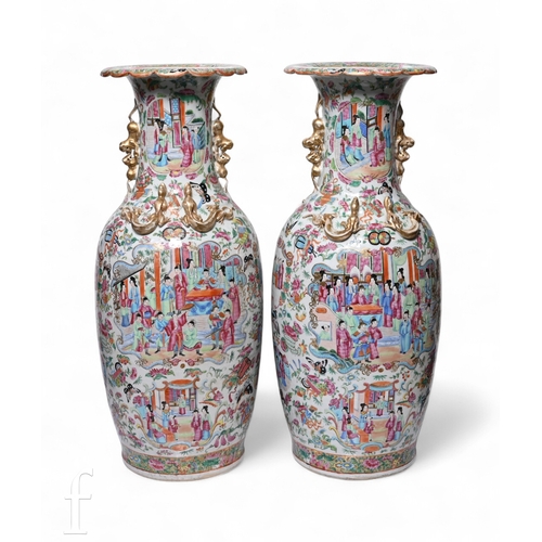 A pair of Chinese late 19th Century Chinese Canton vases, each of ovoid form, rising to an flared and scalloped rim, each side flanked with shishi and adorned with wrythen dragon, each decorated with mirror image scene of officials receiving court, height 62.5cm.