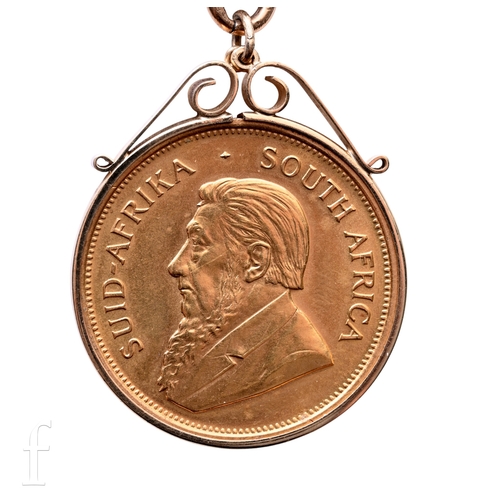 South Africa - A Krugerrand, 1974, in 9ct gold pendant mount and 9ct pendant mount with chain.