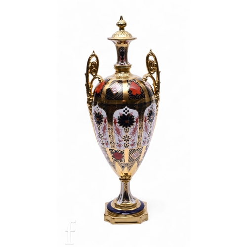 247 - A Royal Crown Derby Old Imari pattern solid gold band twin handled pedestal vase, of ovoid form, ret... 