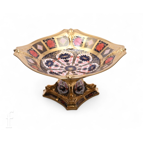 248 - AMENDED DESCRIPTION - A Royal Crown Derby Old Imari pattern solid gold band Dolphin centrepiece, cir... 