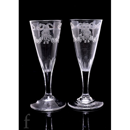 153 - A pair of late 19th Century clear crystal drinking glasses in the 18th Century taste, each with a sl... 