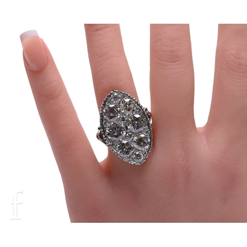 26 - A diamond dress ring, the marquise shaped mount set with six principle brilliant-cut diamonds, with ... 