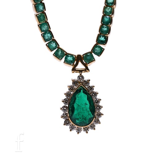 39 - An emerald and diamond necklace, the pear-cut emerald claw set within a surround of nineteen brillia... 