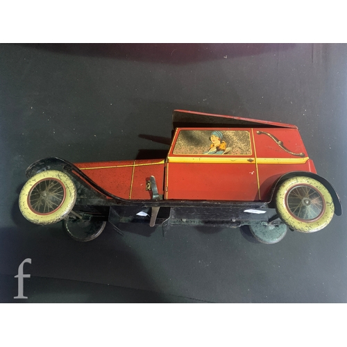 682 - A Crawford and Son biscuit tin, modelled as a Sports Coupe car, in red with gentleman driver and fem... 