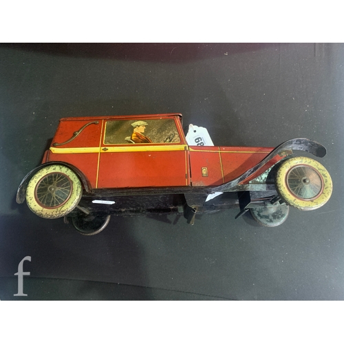 682 - A Crawford and Son biscuit tin, modelled as a Sports Coupe car, in red with gentleman driver and fem... 
