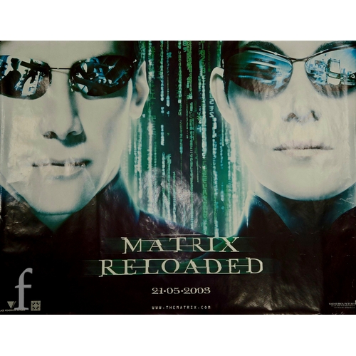 727 - A collection of assorted film and movie posters to include 'The Matrix' and 'The Matrix Reloaded' do... 