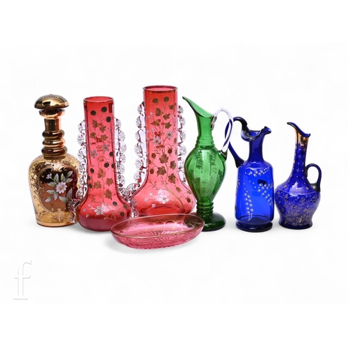 517 - Two late 19th Century cranberry glass sleeve vases, enamelled and gilded with wild fruits and flower... 