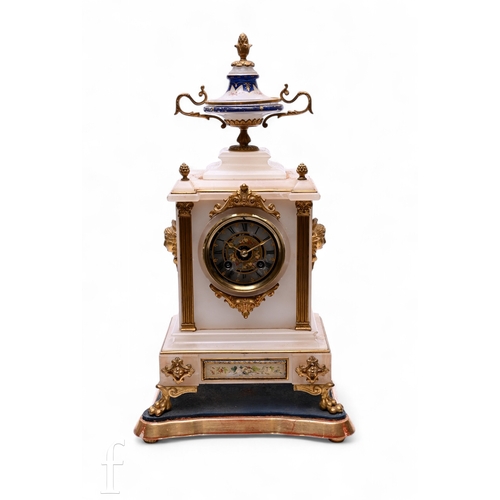 684 - A late 19th Century French mantel clock in alabaster case, with a twin handled urn pediment above a ... 
