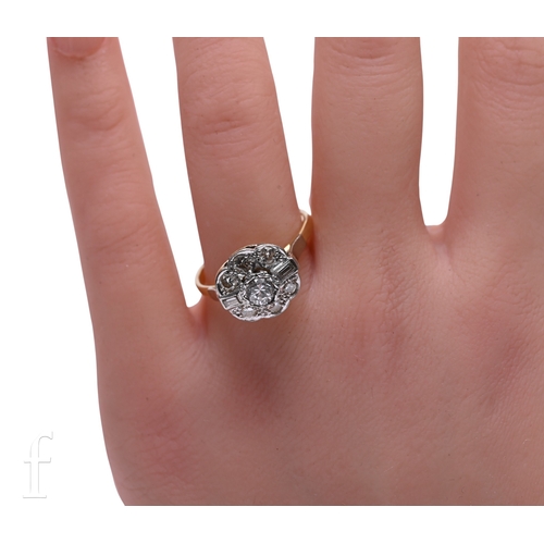 6 - A diamond cluster ring, the brilliant-cut diamonds in fluted collet mount between baguette-cut diamo... 