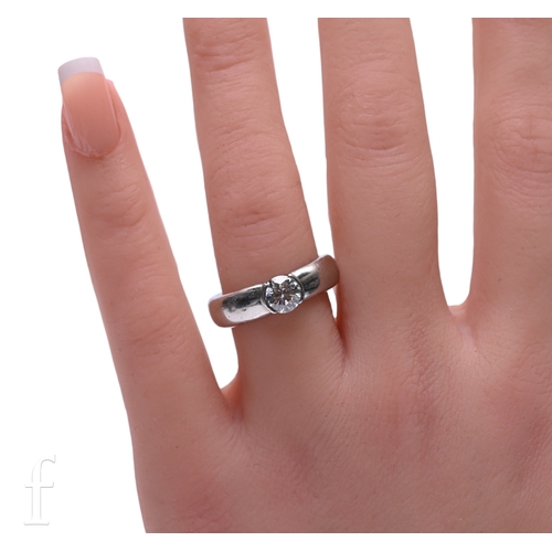 45 - Tiffany & Co; A single stone diamond ring, the brilliant-cut diamond collet set on a broad plati... 