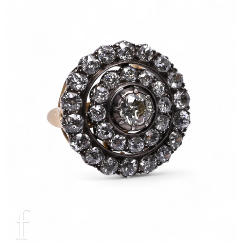 1 - A diamond cluster ring, the upper section circa 1860, of target design composed of an old brilliant-... 
