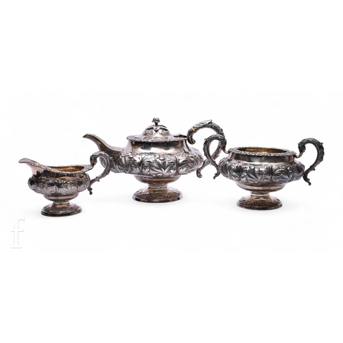1602 - A George IV silver three piece tea service, William Hunter II, London 1829, of compressed footed for... 