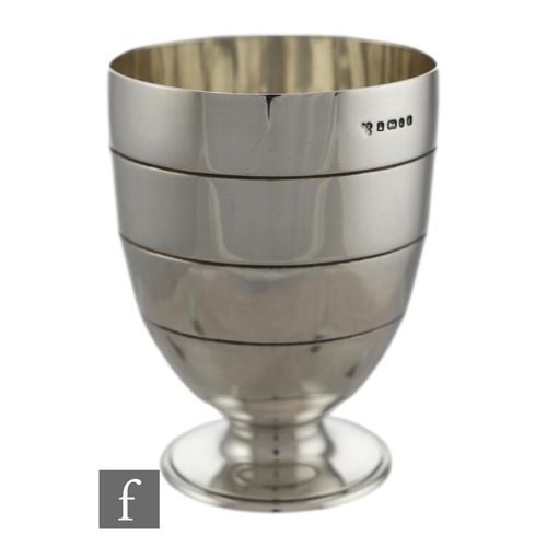 1774 - A Victorian hallmarked silver water jug and two matching goblets, Martin Hall & Co, London 1873 ... 