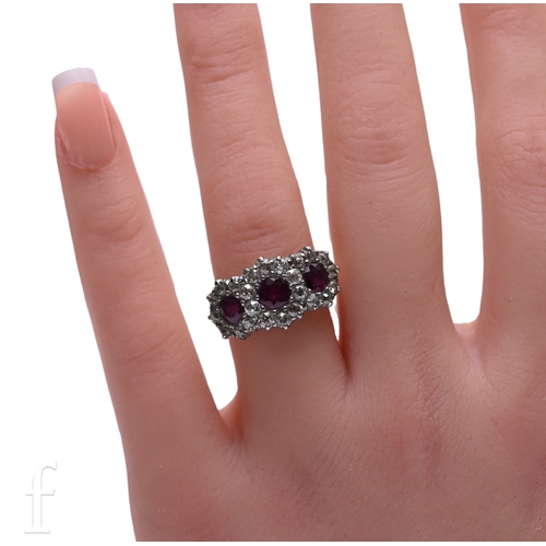 2 - A ruby and diamond ring, circa 1900, the three circular mixed-cut rubies, set with old brilliant-cut... 
