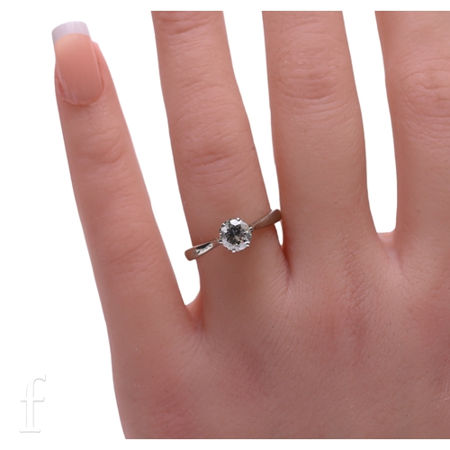 33 - A single stone diamond ring, the brilliant-cut diamond estimated to weigh 0.8 carats, six claw set a... 