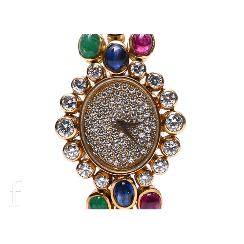 699 - A Delaneau ladies 18ct gold and diamond wristwatch and earrings set, the watch having oval case with... 