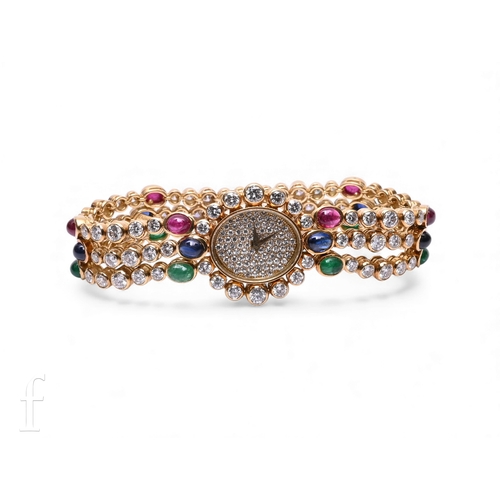 699 - A Delaneau ladies 18ct gold and diamond wristwatch and earrings set, the watch having oval case with... 