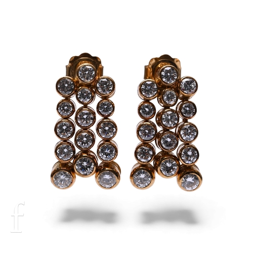 699 - A Delaneau ladies 18ct gold and diamond wristwatch and earrings set, the watch having oval case with... 