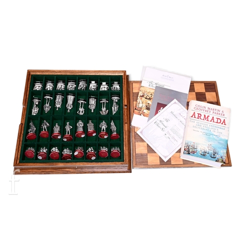541 - An Armada chess set by the Danbury Mint, boxed with certificate and booklet, and a reference book Ar... 