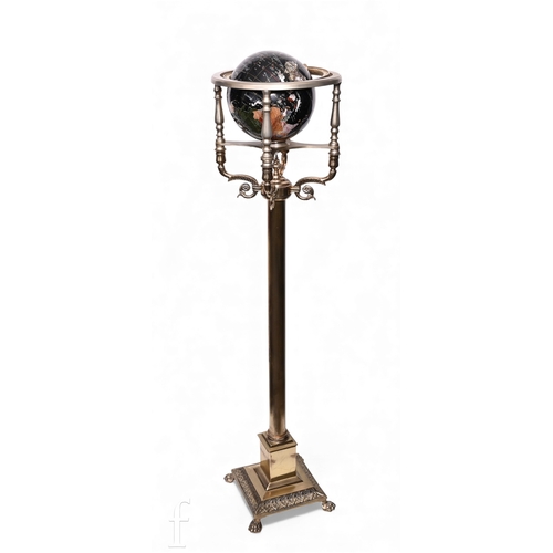 496 - A 20th Century sphere on a brass stand, stepped base and paw feet, height 138cm.