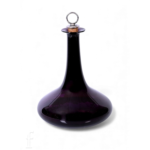 233 - A late Georgian amethyst glass mell decanter, the flattened body below slender neck and flat rim, he... 