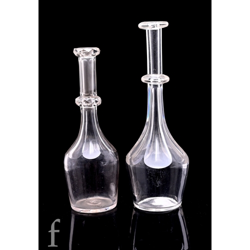 245 - An early 19th Century clear crystal toddy lifter, slice cut slender body and applied medial knop, he... 