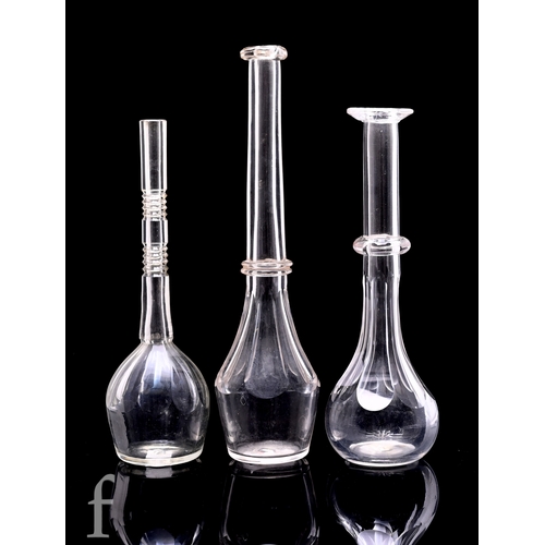 246 - An early 19th Century clear crystal toddy lifter, slice cut slender body and applied double knop, he... 