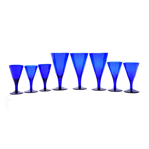 257 - A small collection of Bristol blue drinking wines with drawn conical bowls on plain stems and circul... 