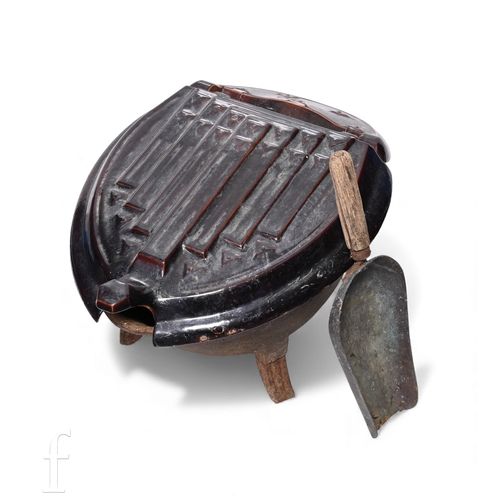 564 - An early 20th Century continental brown enamelled coal scuttle, hinged cover, on splayed legs, width... 