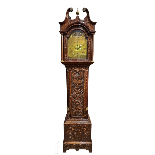 712 - A George III and later longcase clock with eight day movement, the oak case later carved profusely w... 