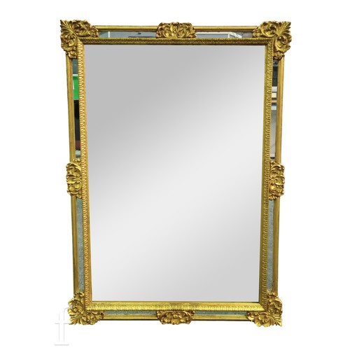 791 - A 20th Century rectangular gilt wall mirror leaf corner mounts, 69cm x 98cm.