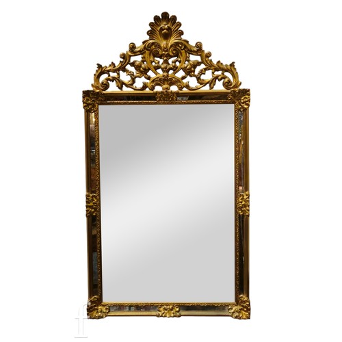 793 - A 20th Century Florentine gilt mirror, the impressive scroll mount over a rectangular plate and inse... 