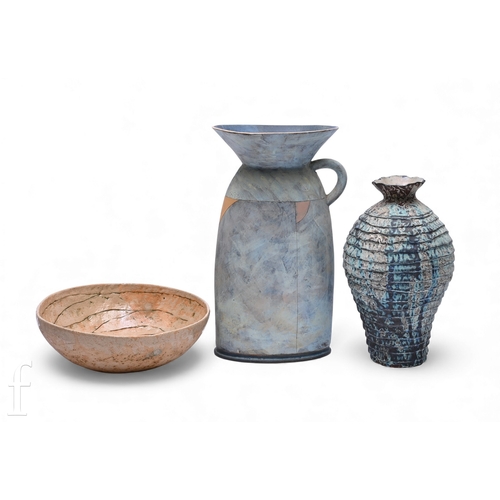 27 - An early 21st Century Monte Sirota studio pottery ewer, of compressed shouldered form with flared co... 