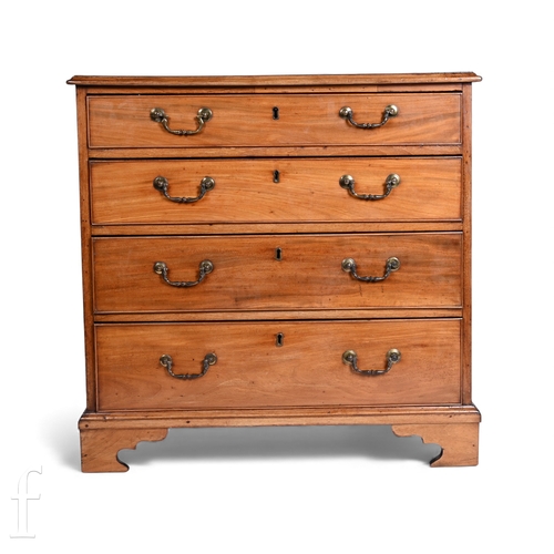 749 - A George III mahogany straight from chest of four long graduated cockbeaded drawers, brass swan neck... 