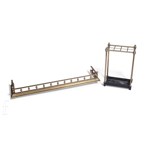 794 - A brass umbrella stand and a small brass fender. (2)