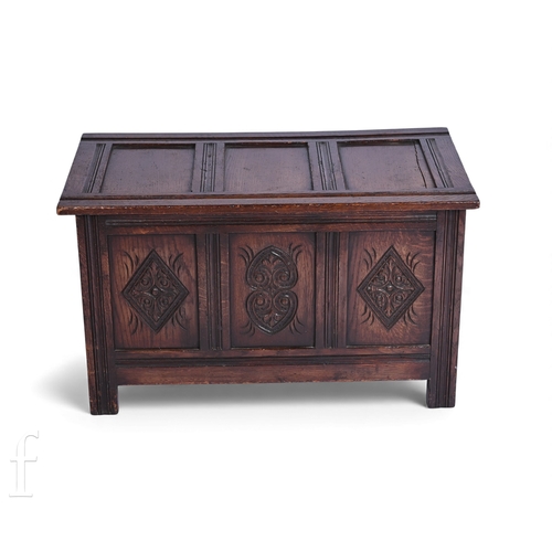 796 - A small 17th Century style oak coffer, panelled front and top on stiles, height 43cm x depth 38cm x ... 