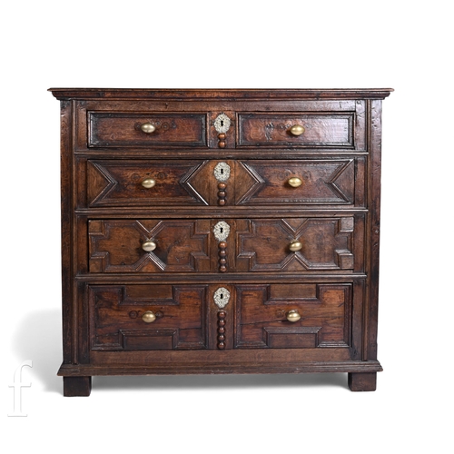 799 - An 18th Century or earlier oak geometric moulded front chest of four long graduated drawers, brass o... 
