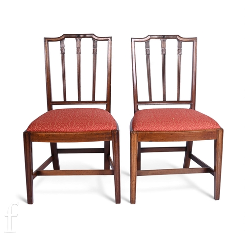 802 - A set of eight Hepplewhite style mahogany dining chairs, carved reeded slat backs below shaped rails... 
