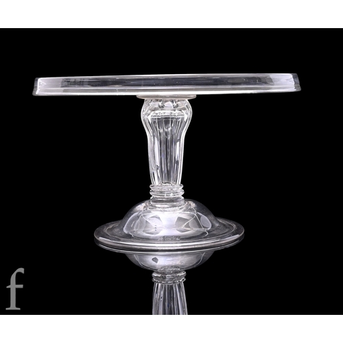 284 - A later 18th Century clear crystal glass tazza, the wide circular top with collar rim, raised on a S... 