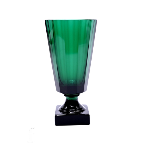 288 - A later 20th Century Kosta Boda pedestal vase by Elis Bergh, the slice cut body raised on spreading ... 