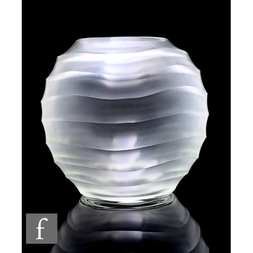 295 - A 20th Century satin finished colourless vase of spherical form, linear cut with deep concave waves,... 